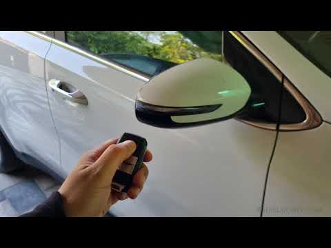 How to enable or disable auto folding mirrors in Kia Sportage