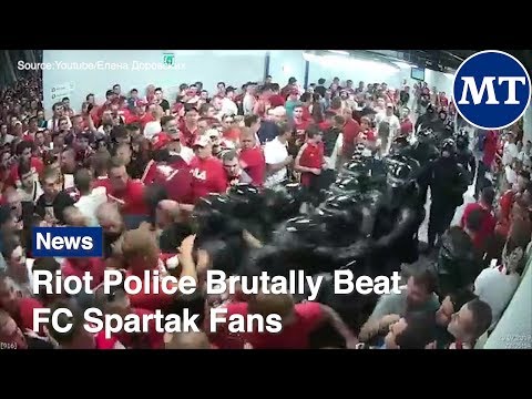 Riot Police Brutally Beat FC Spartak Fans  | The Moscow Times