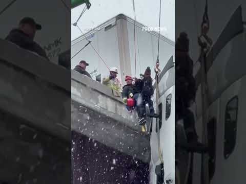 DRAMATIC RESCUE: First responders pull a driver to safety after 18-wheeler skidded off highway #fox