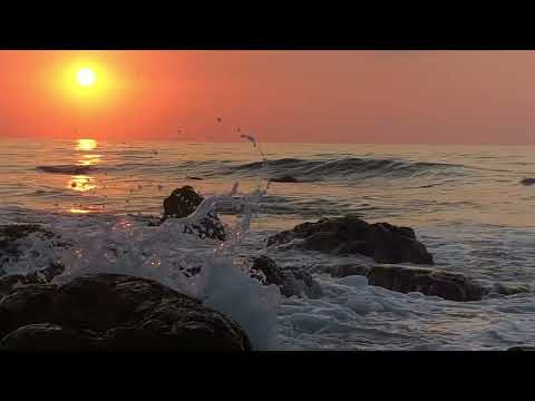 ocean waves crashing into rocks