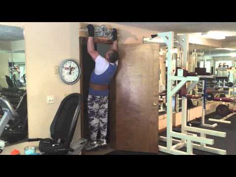 60 year old man does 21 pull-ups in his gym.