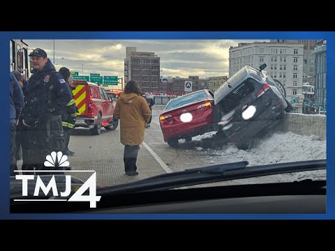 Body cam shows FBI agent rescued after car dangles over highway overpass