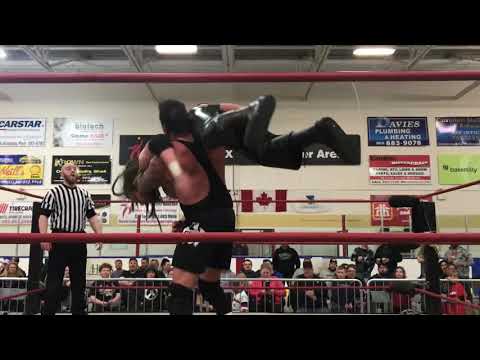 Kowboy Mike Hughes pins Titus for the win