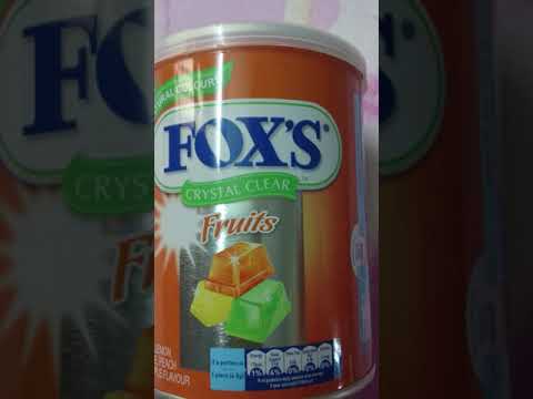 Assorted rectangular imported fox's crystal clear candy tin,...