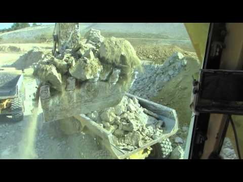 Caterpillar 385B loading Volvo A40F and Bell B45D - Cab view