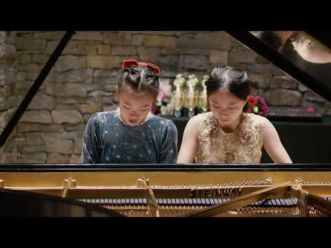 Tiffany and Emma play piano duet Rhapsody Grandioso by Melody Bober