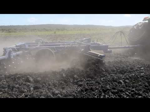 John Deere 6180 y rastra Tatu GTD de 48