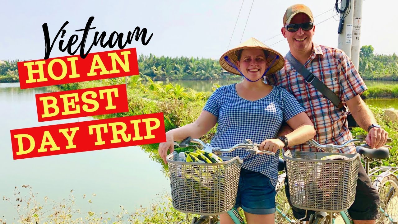 Tourists visit Tra Que Village to experience its traditional farming practices and lush green fields.