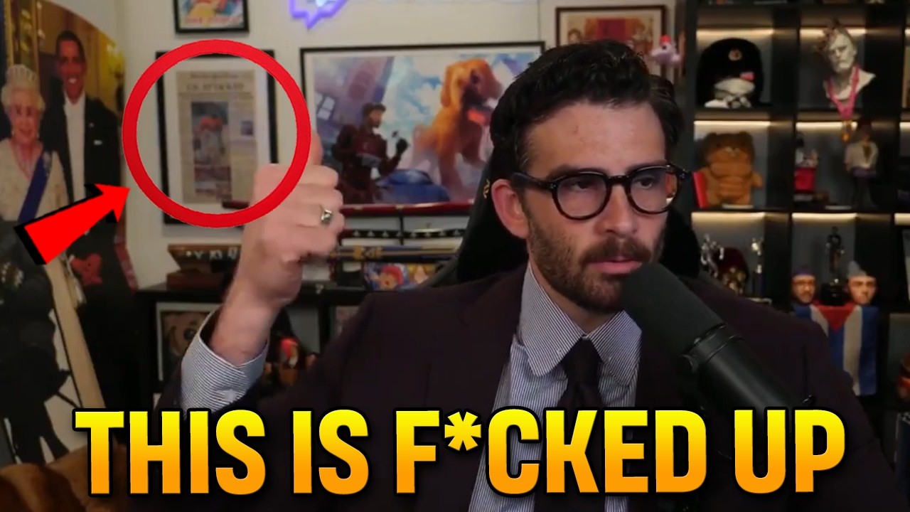 Hasan Piker PROUDLY displays framed 9/11 newspaper showing the Twin Towers IN FLAMES behind him