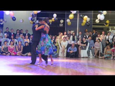  Sebastian Achaval  and  Roxana Suarez  are  dancing  to  a  tango  at  Singapore International Tango Festival  in  2016
