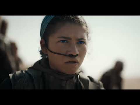 Dune: Part Two official trailer frame with Paul and Chani on Arrakis dunes under a stark sky