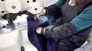 takım elbise pantolonlarının seri üretim süreci. Kore'de engelli dikiş