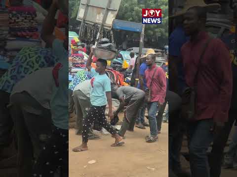 As the minister's convoy pulled up, traders at Madina Station sprang into action—packing their items