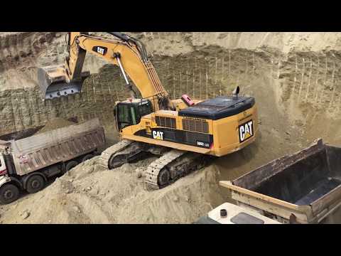 Caterpillar 385C Excavator Loading Trucks