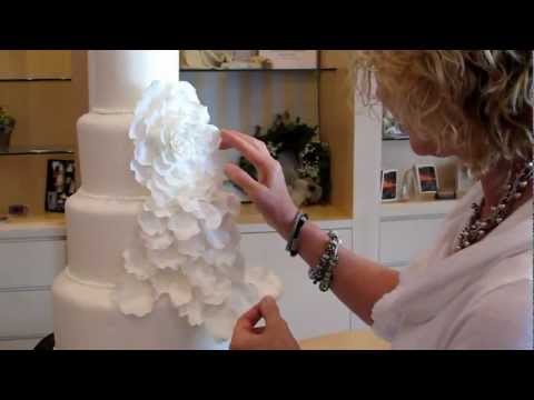 LUXE Wedding Showcase - Take the Cake, applying flower petals to wedding cake