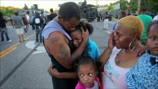 Police use tear gas and rubber bullets on protesters in Ferguson, Mo.