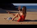 A Girl In Pantyhose Reading At The Beach