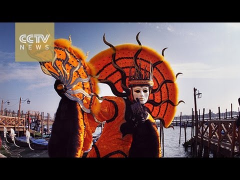 Venice Carnival: Revelers in costumes in the ancient city