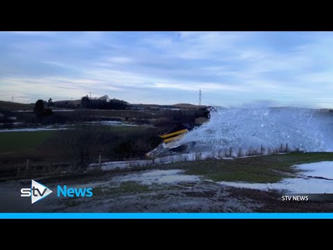 Rail plough smashes through snow to clear tracks