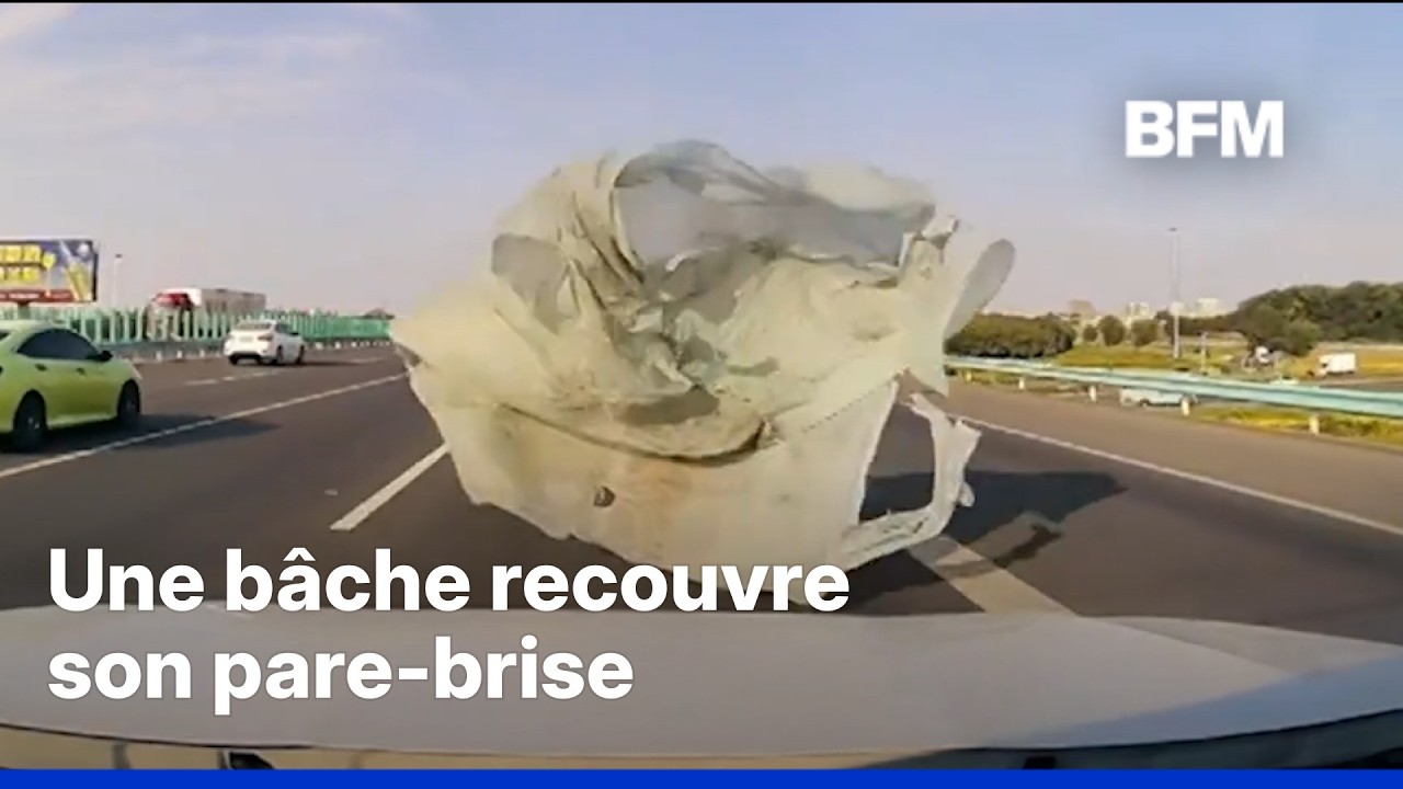 En Chine, une bâche envolée d'un camion tombe sur le pare-brise d'un automobiliste