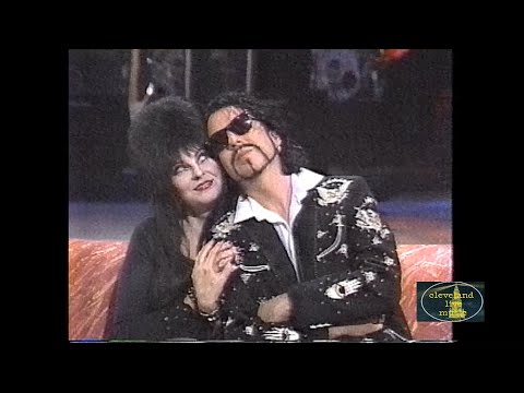 Dave Stewart on the Traveling Wilburys flirting with Elvira - Into The Night 10/31/90