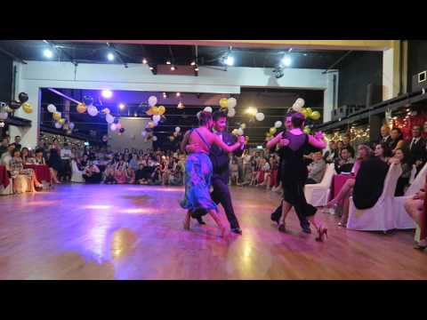  Yanina Quiñones,    Sebastian Achaval,    Roxana Suarez,    and  Neri Piliu  are  dancing  to  the  milonga  "  Milonga Querida  "  by  Juan D'Arienzo  at  Singapore International Tango Festival  in  2016
