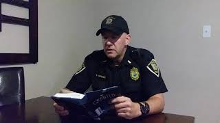 Lt. Nick Berzac of the Merrillville Police Department reads the first chapter of Granted