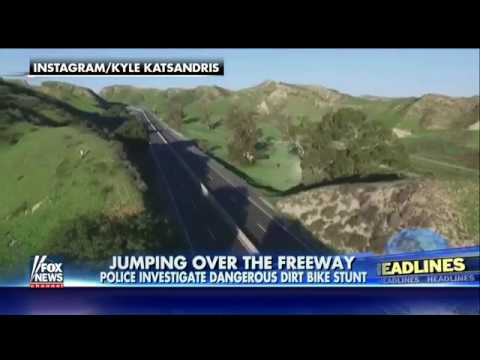 Dirt bike jumps over the freeway