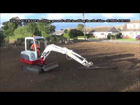 Levelling Soil With Steel Levelling Bar Attached To Takeuchi TB228