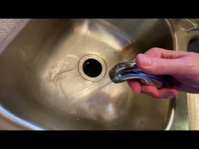 Best Delta Metering Faucet for Water Conservation - product in use