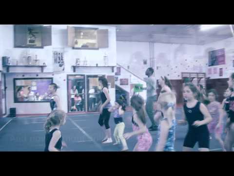Julien Believe Shows the kids at Envision Gymnastics School How to Caribbean Slide
