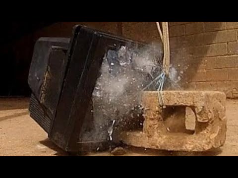 TV Smashed with Concrete Block - Slow Motion
