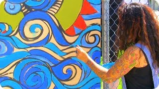 Local artists help students add color to neighborhood
