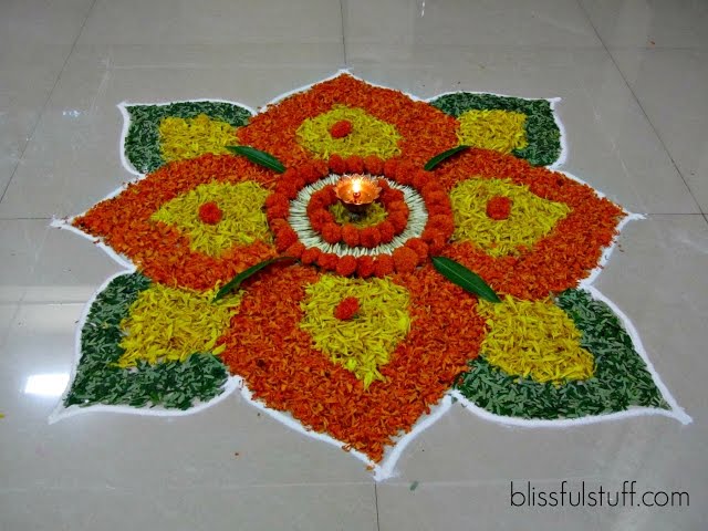 Beautiful onam pookalam designs with marigold flowers by Poonam Borkar