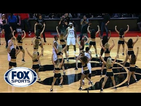 LeBron James and the Cavs surrounded by Toronto Raptors dancers