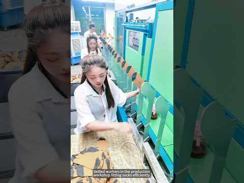 Skilled workers in the production workshop fitting socks efficiently.#amazing #work #workers