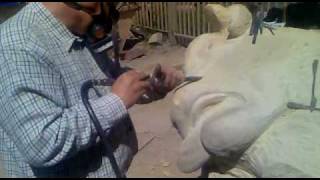 Simon Winter caving a Stricken Minotaur with an airtool.