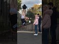 Policeman stuck upside down on fence with skid marked pants on