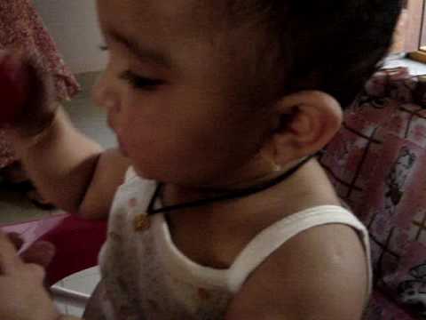 Shalvee enjoying tomato