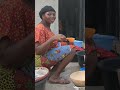 A Nigerian Woman Drinking A Local Pap Shorts Shortsafrica