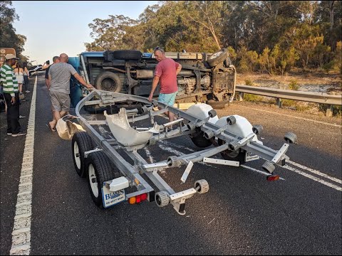 Driver attempts high speed overtake while towing boat and rolls - Braidwood NSW
