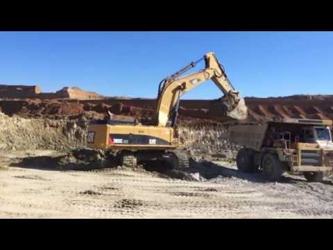 Caterpillar 385C ME Excavator Loading Cat Dumpers and Volvo