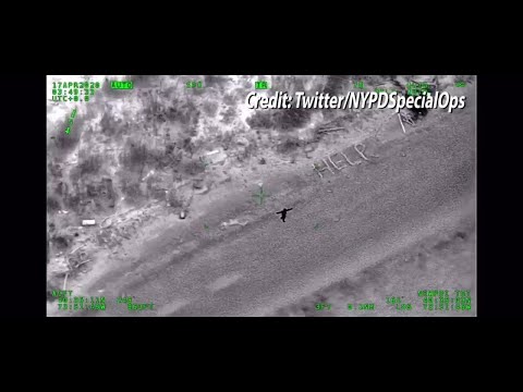 Rescue video of stranded kayaker who spelled out HELP with sticks on tiny island