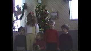 Kids singing I Saw Mommy Kissing Santa Claus