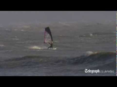 Windsurfers ride storm waves in Dorset