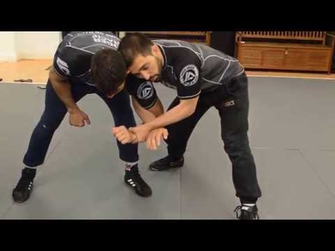 Two on One hand control lock ( draging the opponent down or double takedown)
