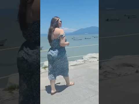 walking on dubai beach with blue frok