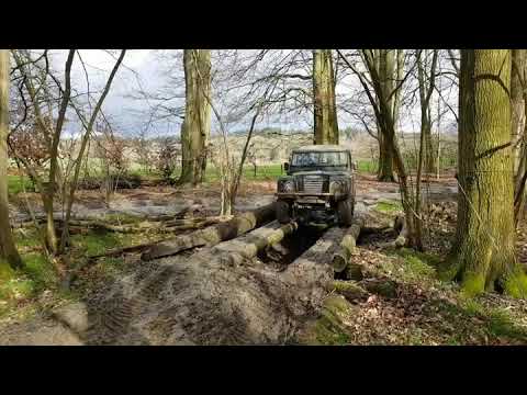 Ian driving over the log bridge
