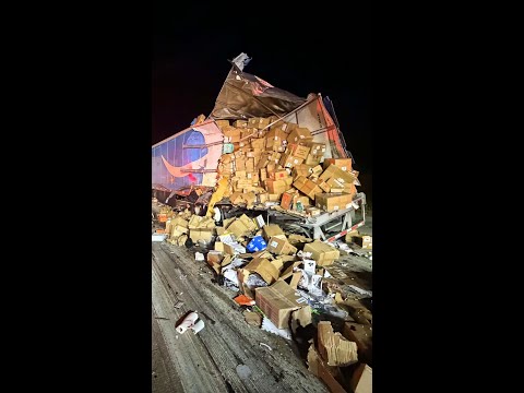 Amazon packages spill onto a highway after a crash