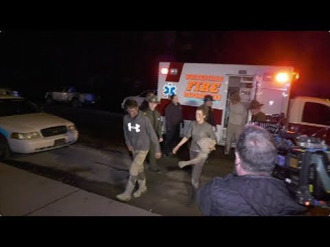 Three people missing since last weekend were found alive Wednesday and rescued from an underground coal mine in southern West Virginia, authorities said. TV news video later showed them emerging from an ambulance as friends and family cheered. (Dec. 13)